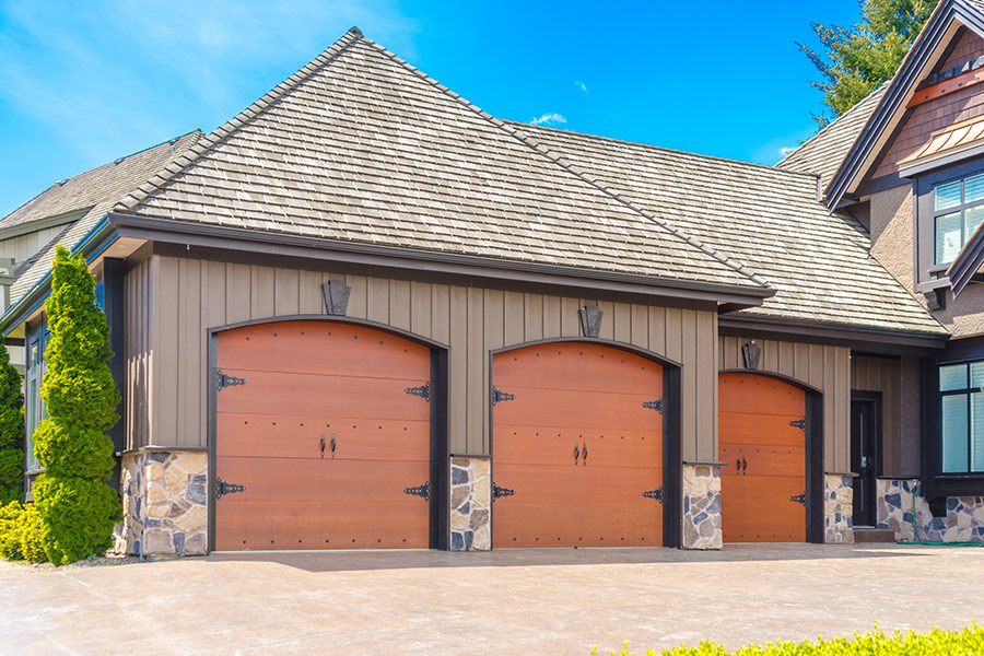 triple-wooden-garage-door-installed-at-house-exteriors-mahopac-ny