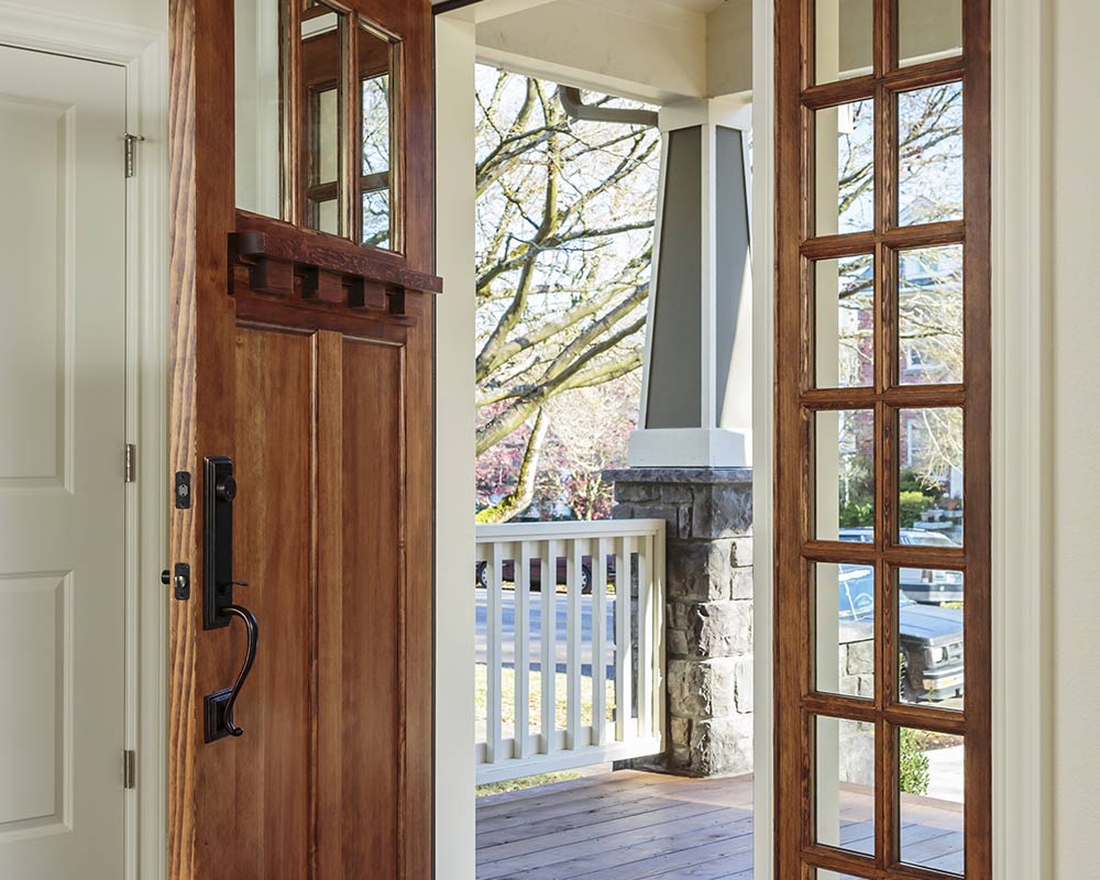 open wooden front door from inside of home yorktown ny